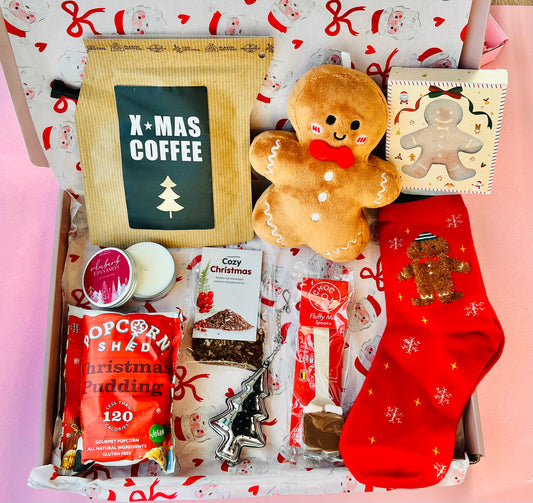 Ontdek de Cadeaubox Kerst Rood van The Prezzent – feestelijk verpakt, vol lekkers, thee en kaarsen. Het perfecte kerstcadeau om te geven of te krijgen.