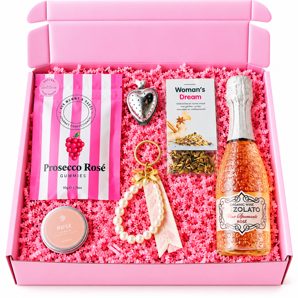 Roze cadeaubox voor je vriendin met rosé bubbels, prosecco-gummies, kruidenthee, lippenbalsem en een gouden sleutelhanger met parels, feestelijk verpakt in roze opvulmateriaal.