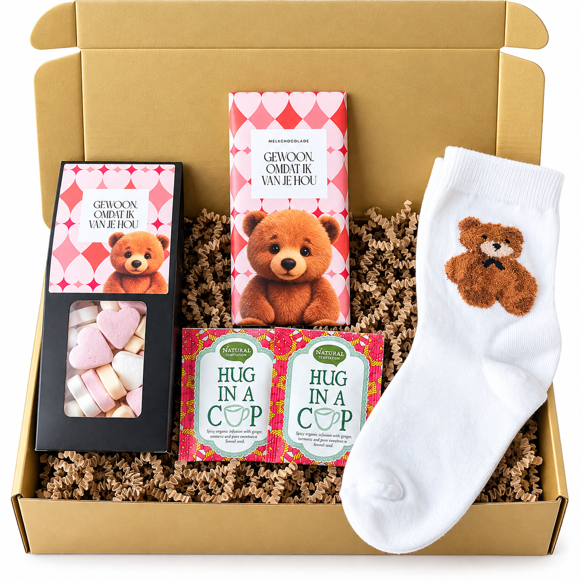 Gouden cadeaubox met witte teddybeer sokken, melkchocolade met teddybeerprint, roze hartjessnoepjes en twee Hug in a Cup theezakjes