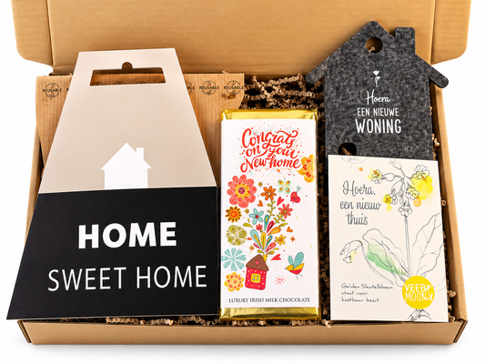 Nieuwe woning cadeaubox met Home Sweet Home decoratie, chocolade en cadeau voor een nieuw huis