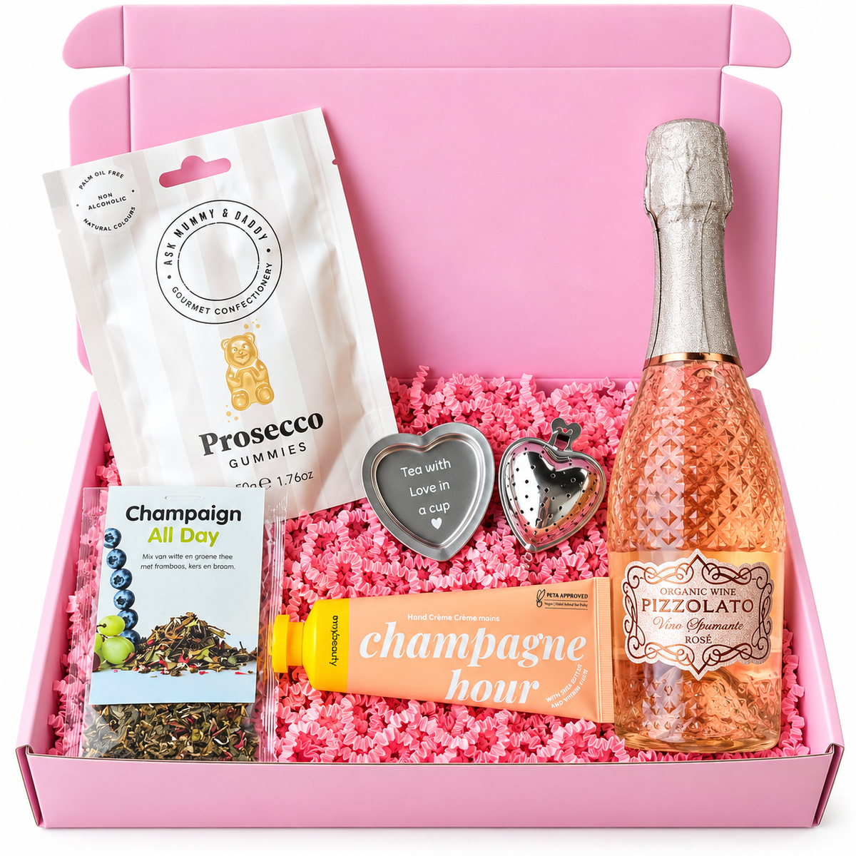 Roze cadeaubox met Prosecco gummies, rosékleurige Pizzolato mousserende wijn, Champagne All Day thee, Champagne Hour handcrème en twee hartvormige theeaccessoires.