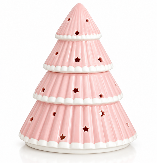 Roze keramieken oliebrander in de vorm van een kerstboom met witte details en stervormige openingen
