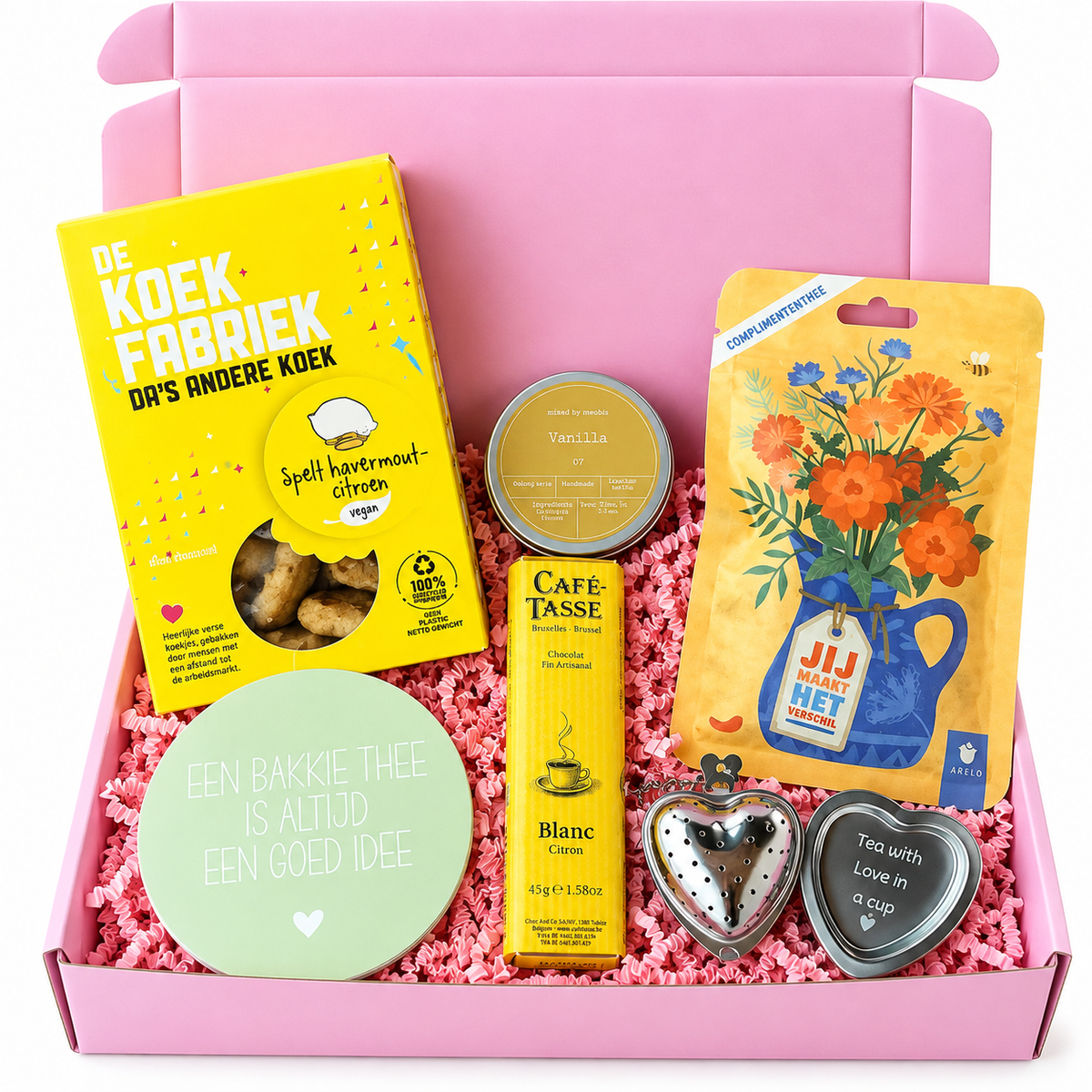 Roze cadeaubox met koekjes van De Koekfabriek, vanillethee, citroen-chocolade, complimententhee en hartvormige theezeefjes