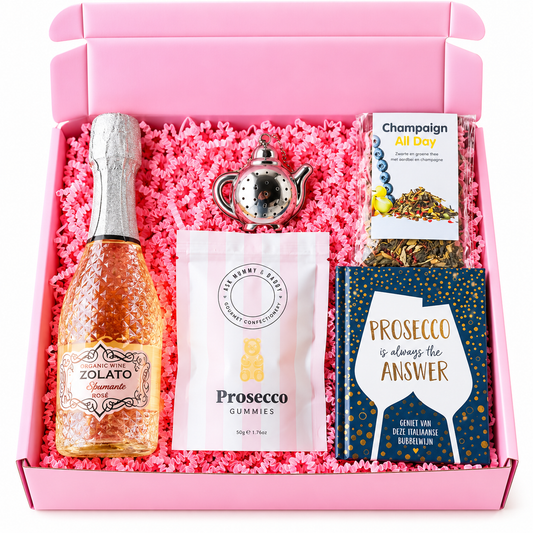 Roze verjaardagscadeaubox met rosé mousserende wijn, prosecco gummies, Champagne All Day thee en een prosecco cadeauboekje van The Prezzent.